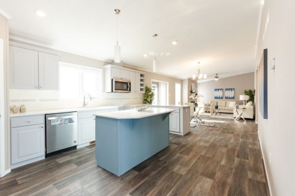 House with two tone cabinets and wood flooring