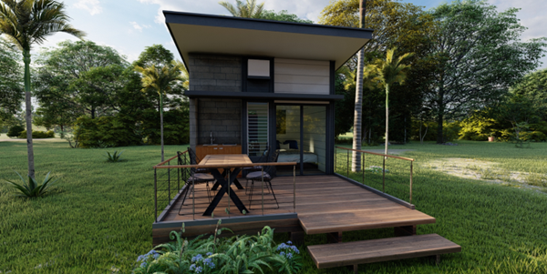 tiny home outside in green field